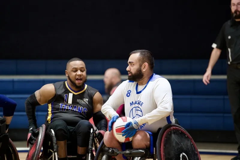 Two opponents share a laugh between plays