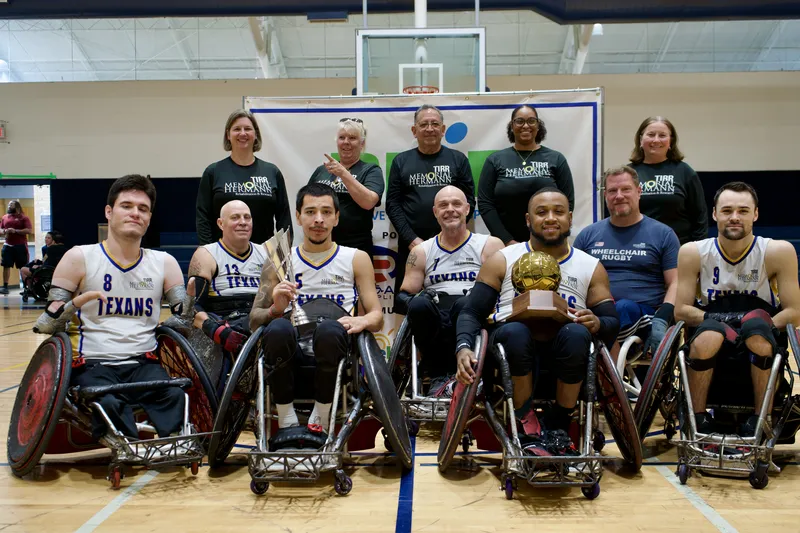 The full championship team and support crew gather for the trophy photo