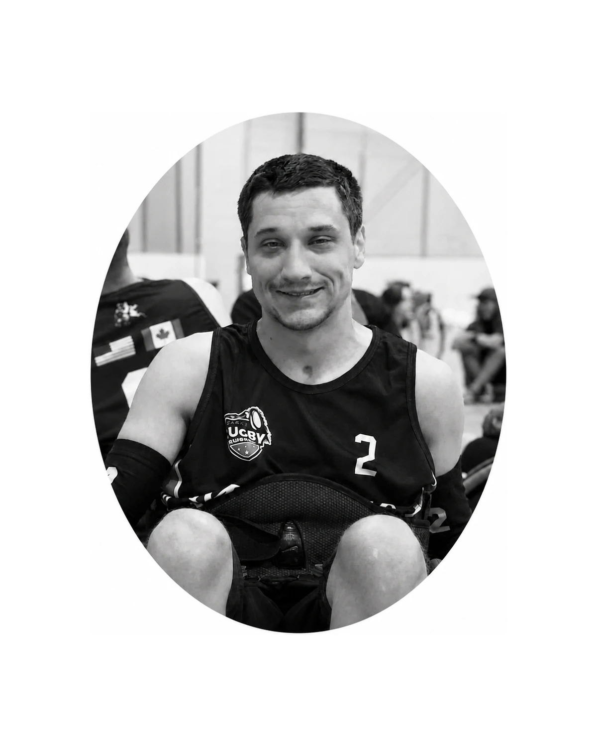 Black-and-white memorial portrait of wheelchair rugby player Robbie Dudzisz